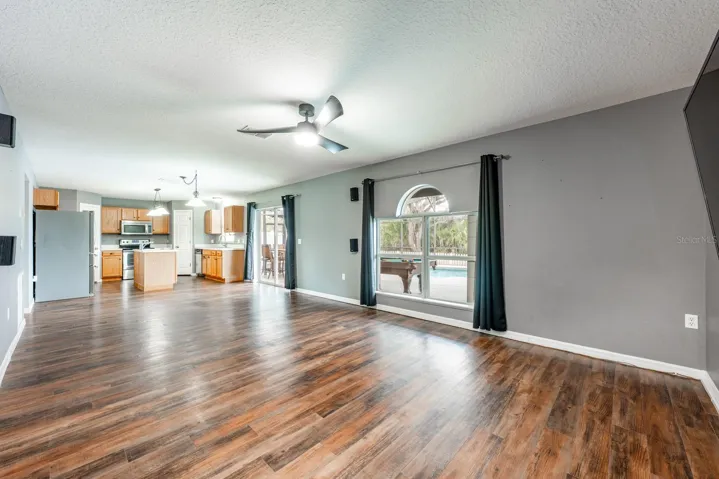 Open family room, dining space and kitchen.