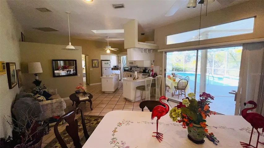 Sliders to pool from kitchen/dining area