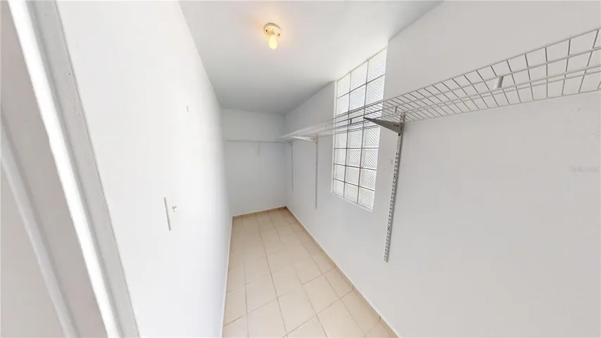 walk in closet at master bedroom