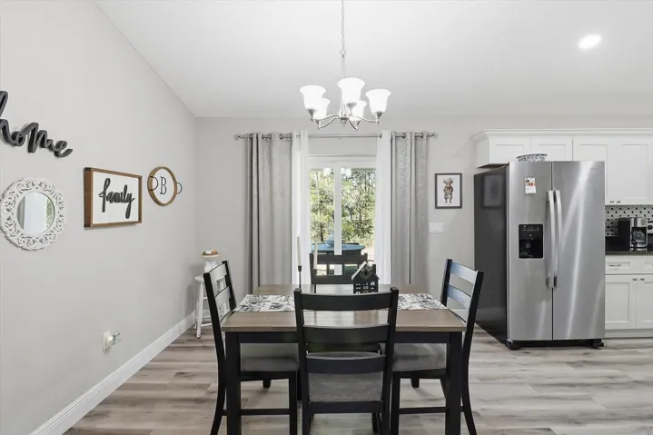 Dining Room w/ Slider that Opens to the Covered Patio