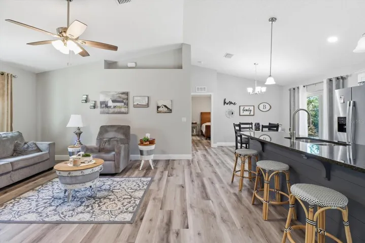 Open Floor Plan with Vaulted Ceiling & Luxury Vinyl Planking Throughout