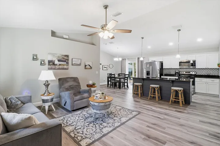 Open Floor Plan with Vaulted Ceiling & Luxury Vinyl Planking Throughout