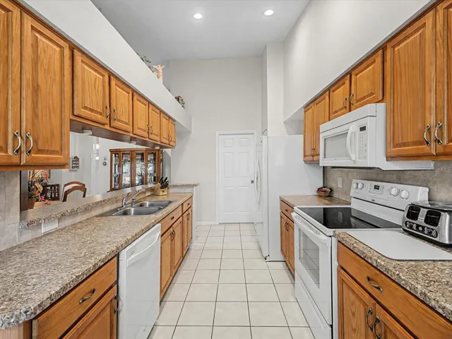 Galley Kitchen Overlooks Dining Room