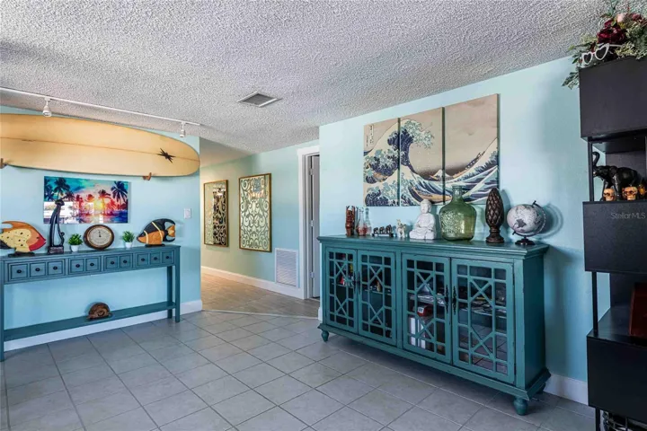 The other side of the dining area and hall to front door.