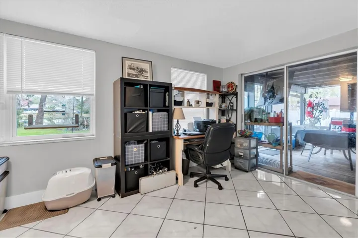 Dining room or Florida Room. Located on the back of the home/water side.
