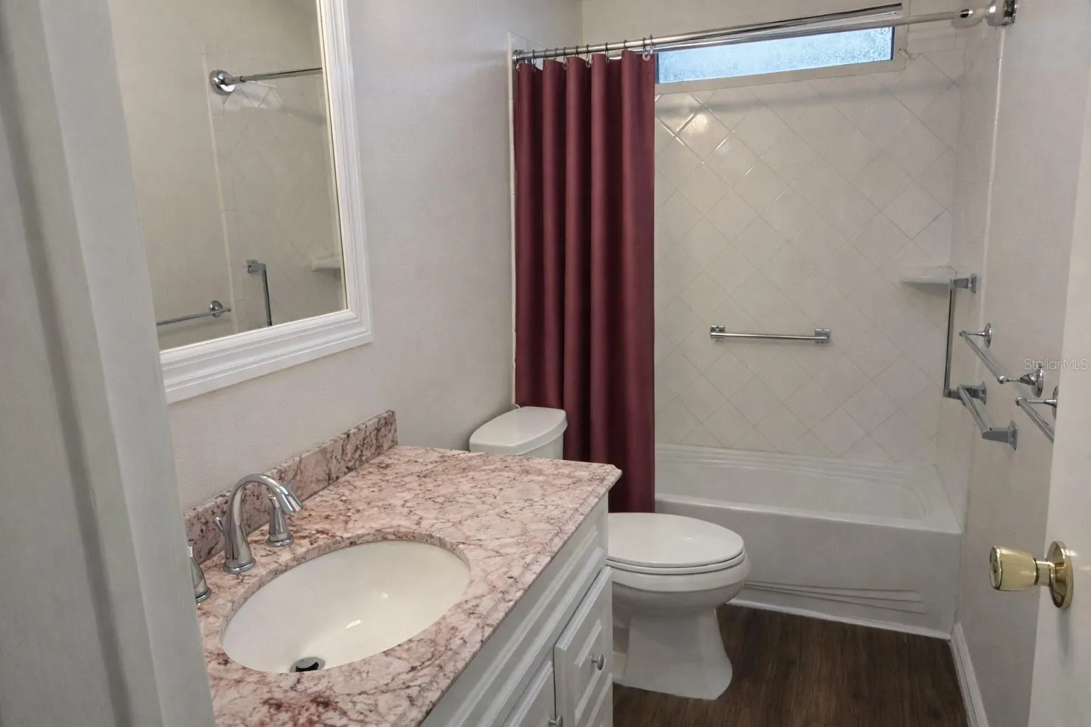 Guest bathroom with tub and shower combination