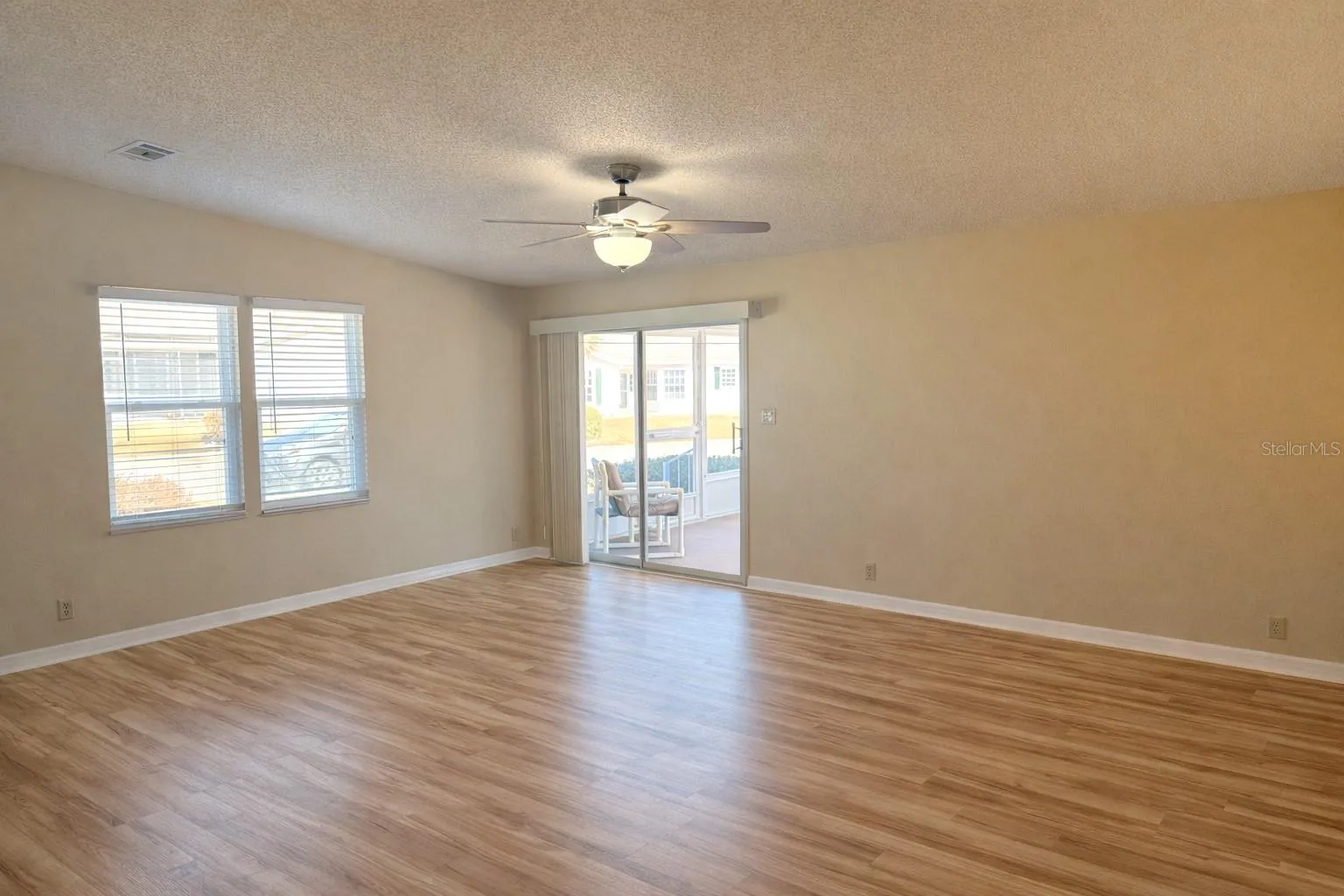 Freshly painted living room with newly installed laminate flooring