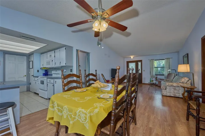 GREAT ROOM FROM DINING ROOM WITH VAULTED CEILING