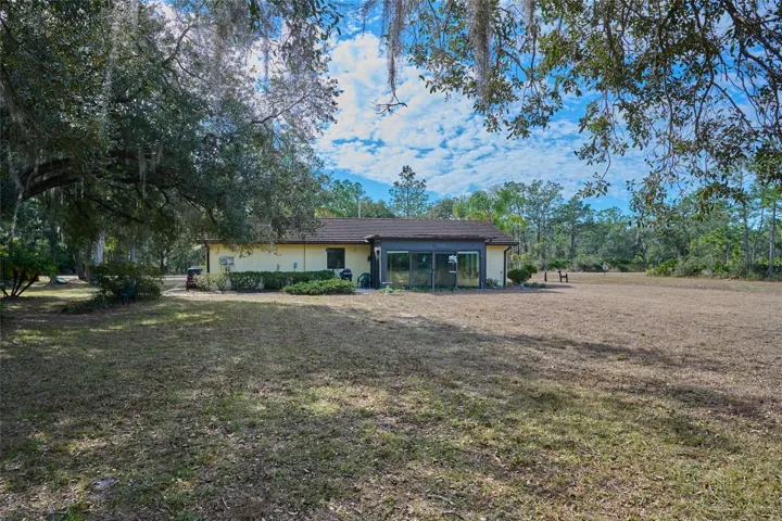 BACKYARD WITH MATURE TREES AND OPEN SPACE