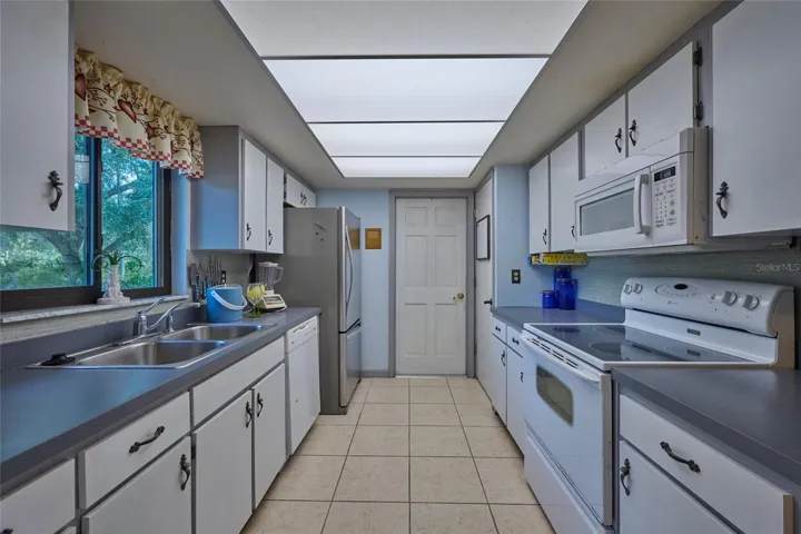 KITCHEN WITH VIEW OF DOOR TO GARAGE