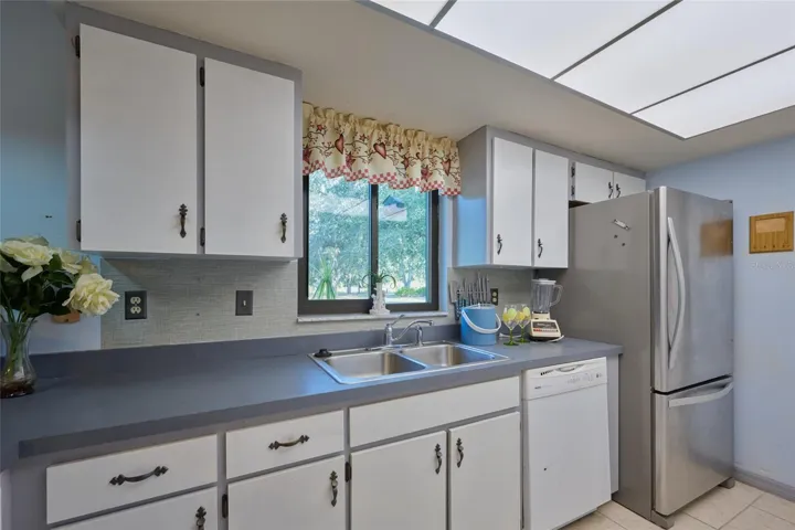 KITCHEN WINDOW TO BACK YARD