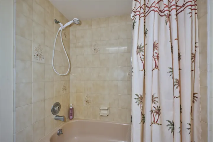 PRIMARY BATHROOM WITH TUB AND SHOWER