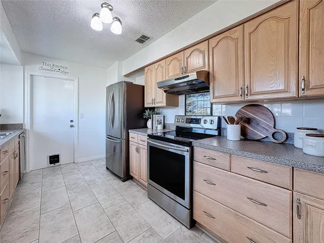 Kitchen w/ Stainless Steel Appliances