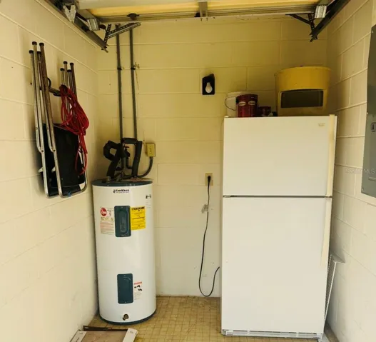Full Size Refrigerator in Garage conveys