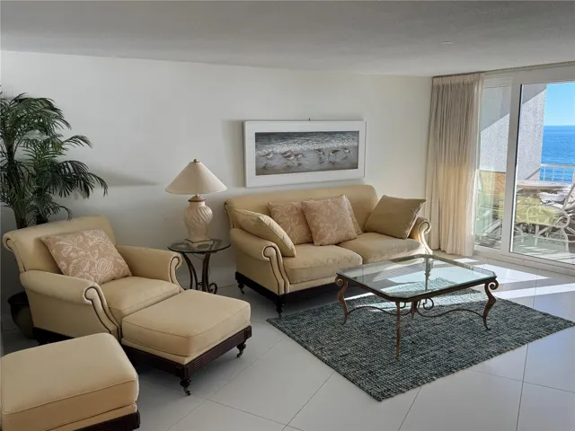 Living room opens to balcony and gulf view