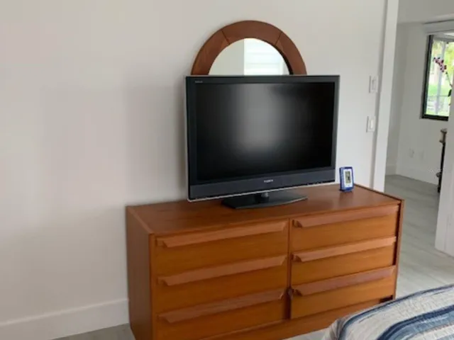 Primary bedroom dresser and TV