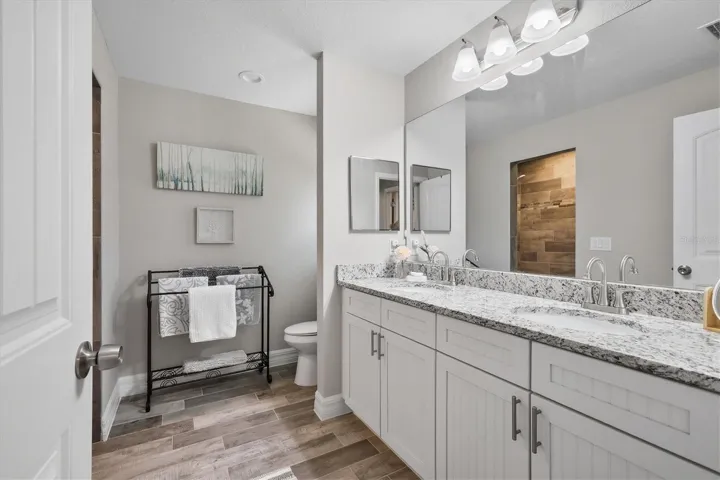 PRIMARY EN SUITE WITH DUAL SINKS, WALK IN SHOWER, WALK IN CLOSET APPX. 6'X8'