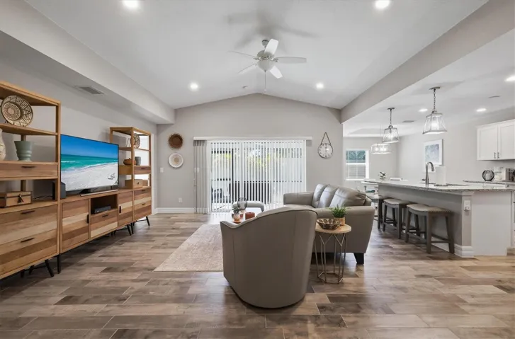 GREAT ROOM AND KITCHEN VIEW FROM ENTRY FOYER, DINING FAR RIGHT REAR