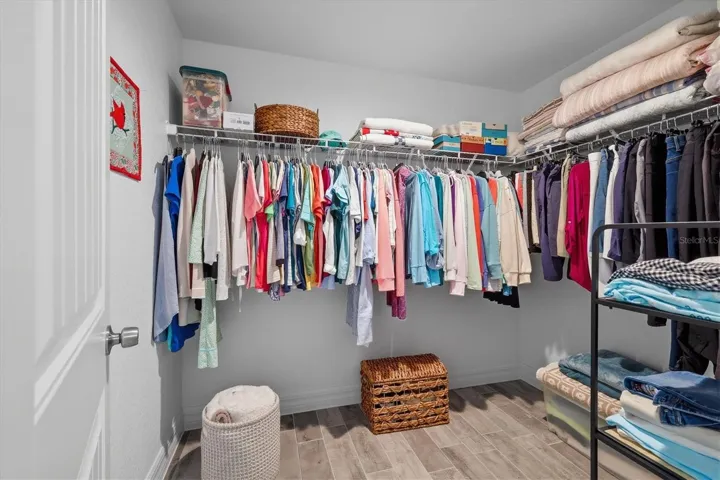 SPACIOUS WALK IN CLOSET IN PRIMARY IS APPX 6'X8'