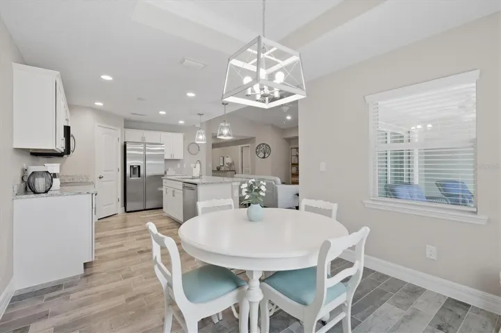 DINING AREA OVERLOOKING KITCHEN AND GREAT ROOM