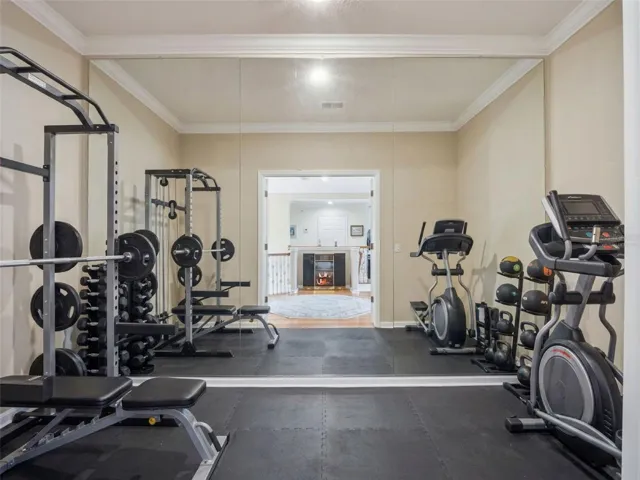 Upstairs flex room virtually staged as a Workout Room.