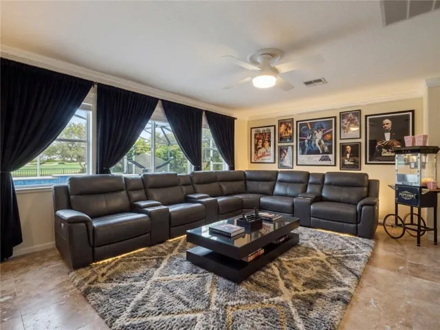 Upstairs Living space virtually staged as a Theater Room.