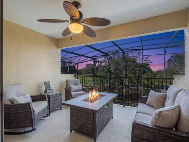 Balcony overlooking the pool and golf course! This picture has been virtually staged.