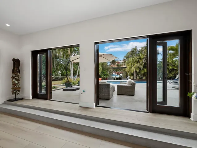Mahogony french doors open wide for a perfect indoor/outdoor balance