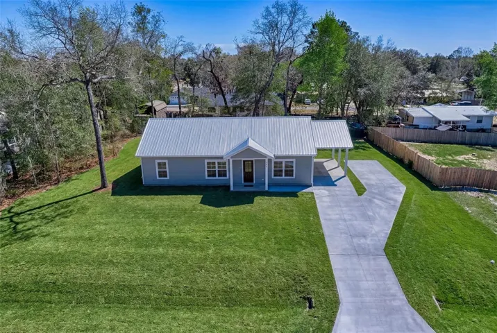Carport as well as extra parking area
