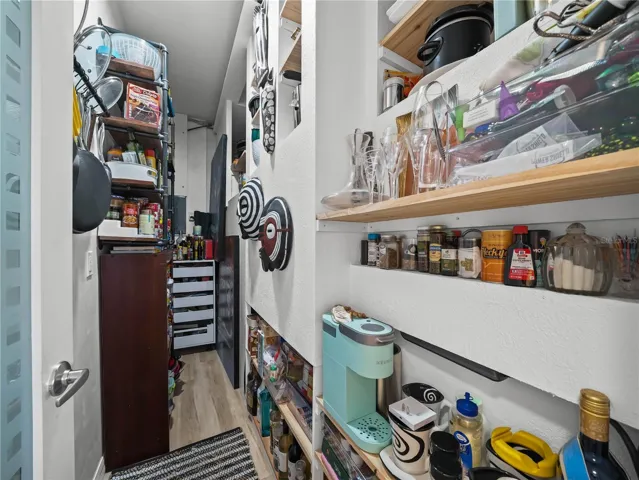Custom Walk In Pantry behind Kitchen Wall