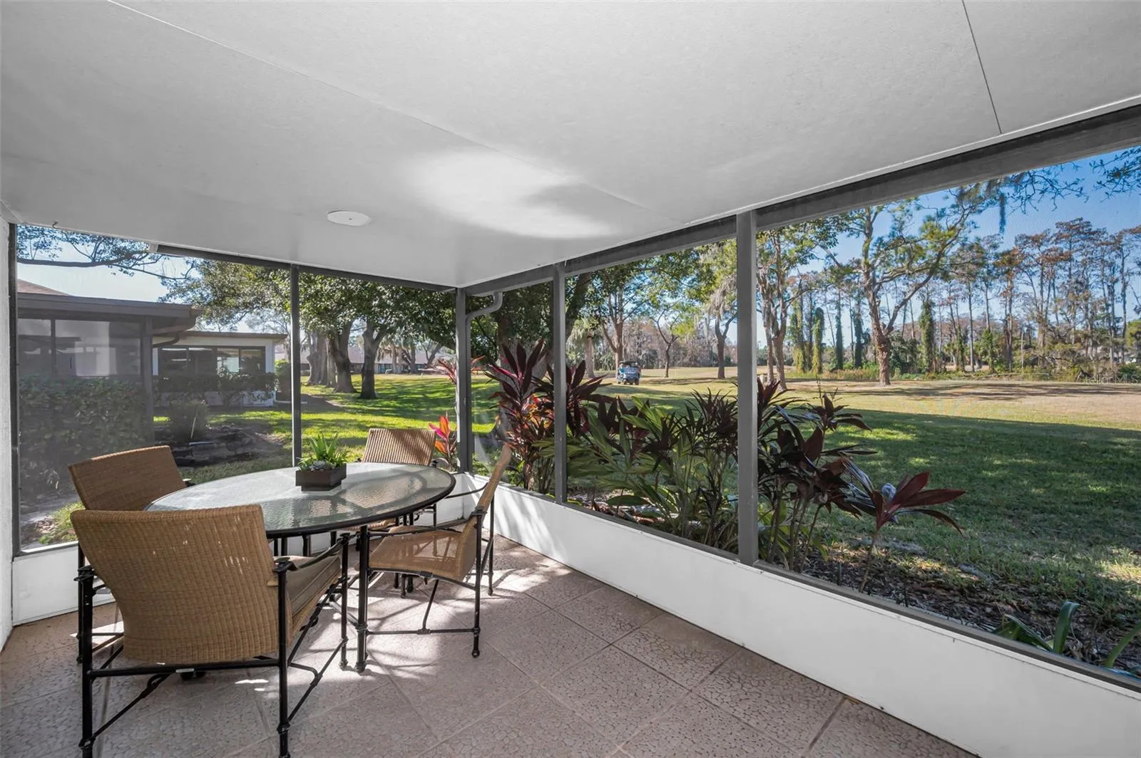 Enclosed porch overlooking pond and golf course!
