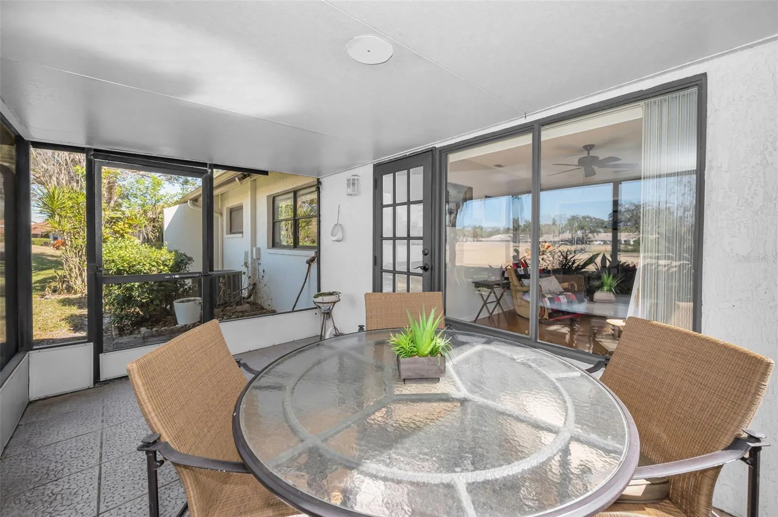Enclosed porch overlooking pond and golf course