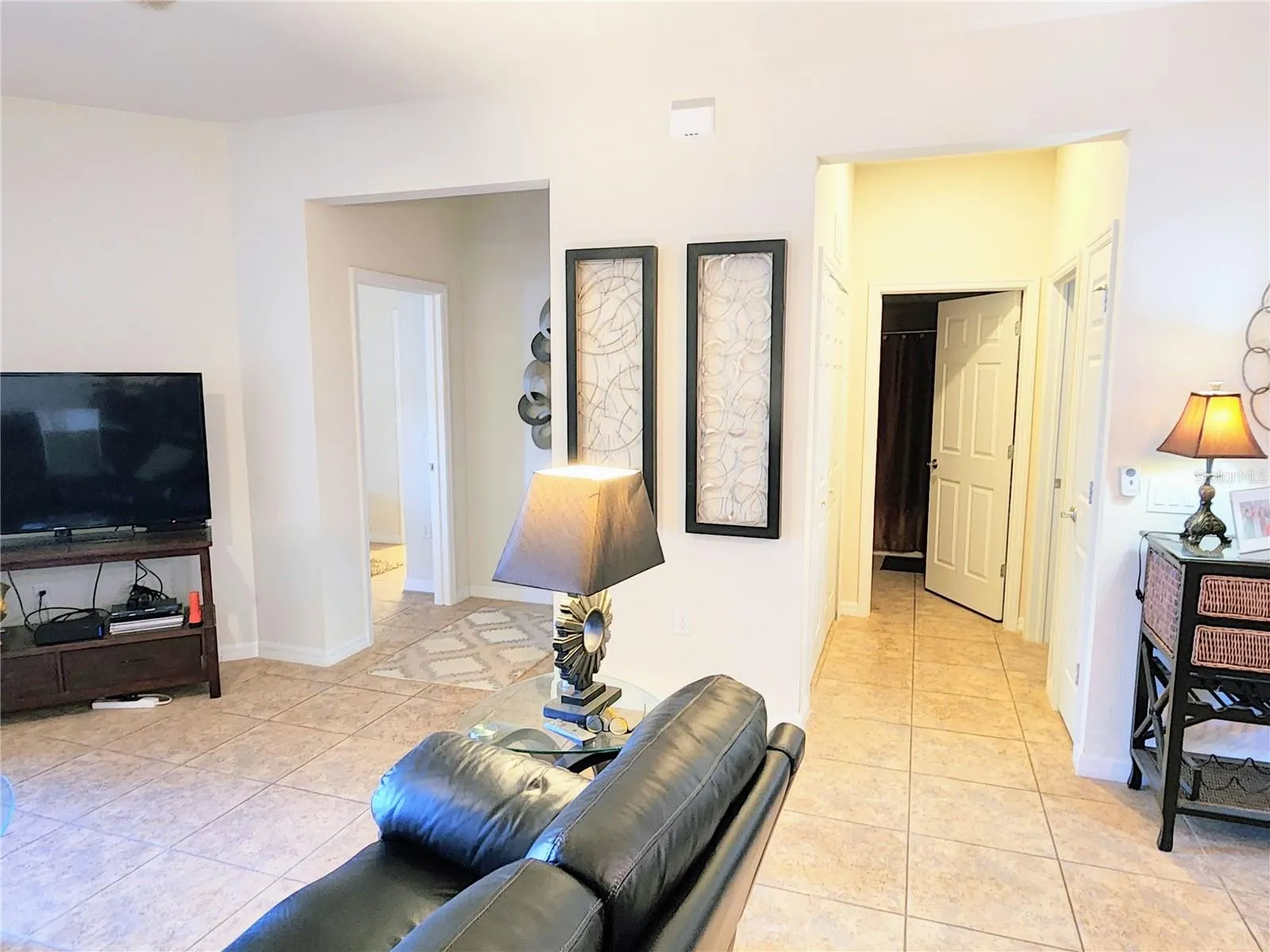 There are two hall entrances, one to the master bedroom area and the other to the 2nd bedroom, guest bath and laundry closet