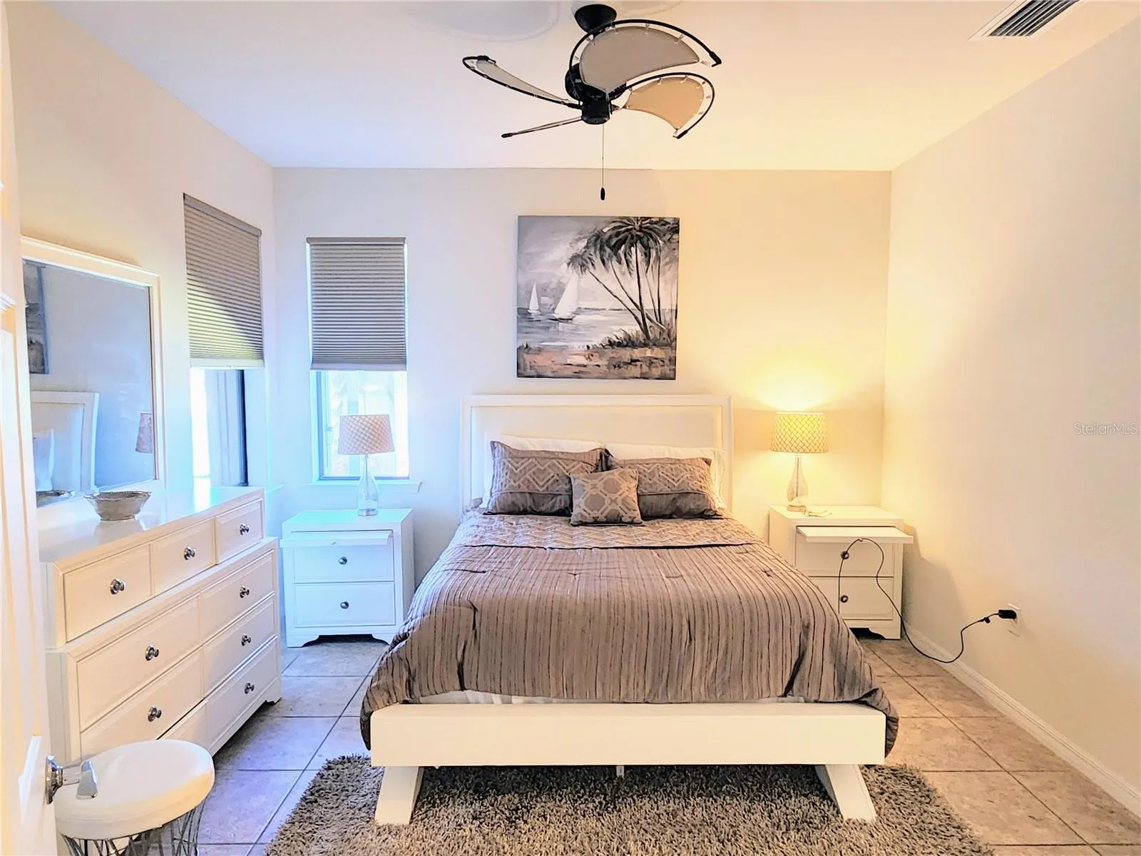master bedroom with nice blinds and ceiling fan