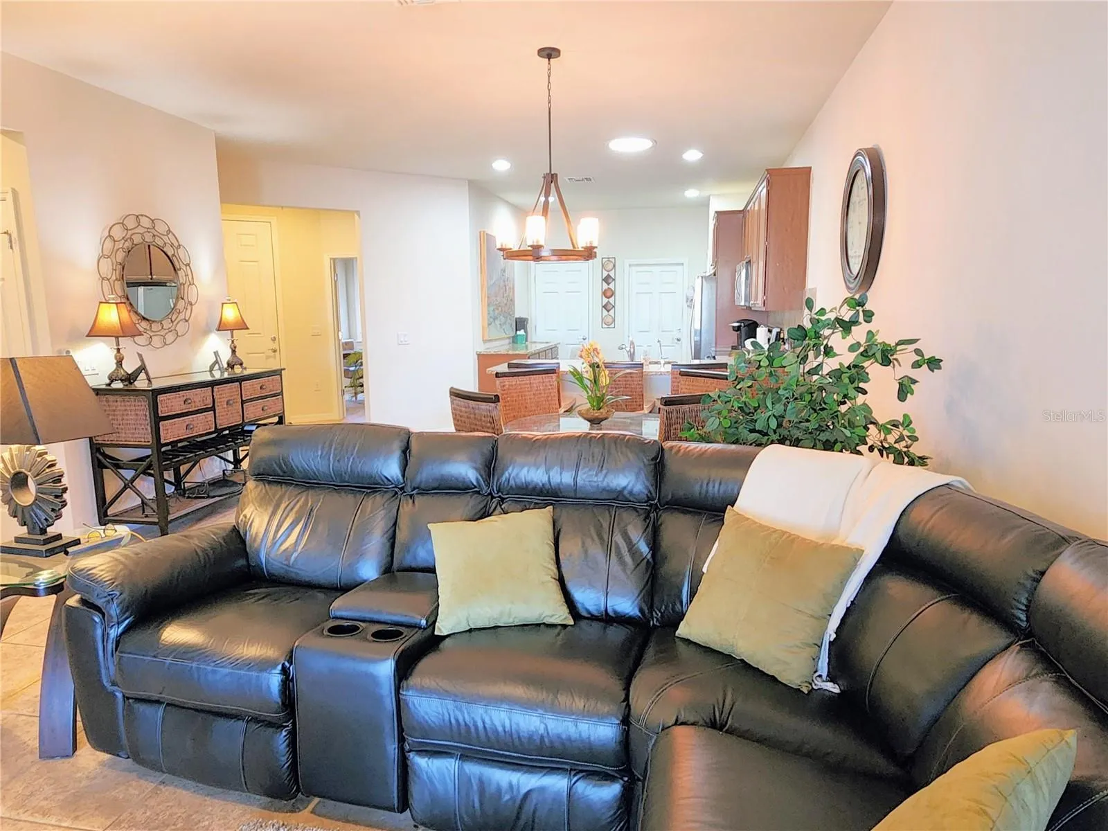 The sofa has 2 electric reclining chair and a 3rd reclining manual seat. It also has storage and cup holder