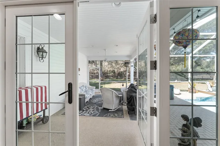 French doors from dining room to the lanai & pool