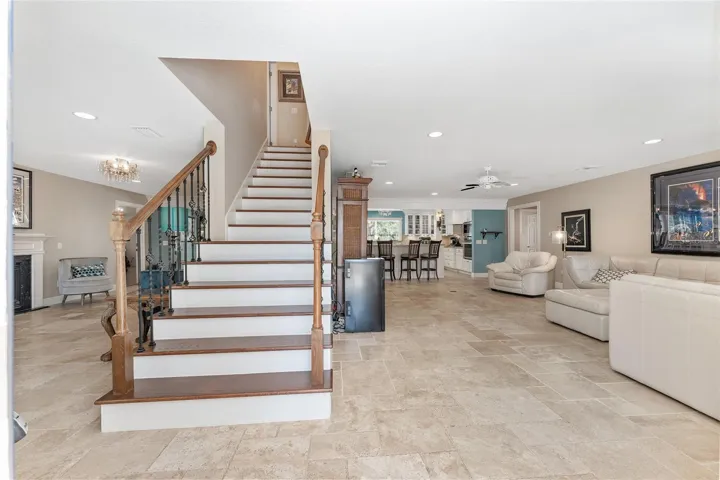 The family room & living room are separated by the stairs to the 2nd floor