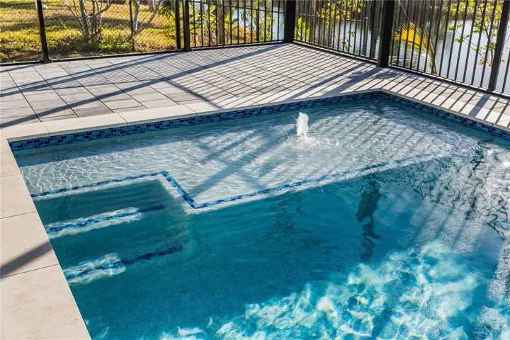 Designed for year-round enjoyment, it offers both relaxation and entertainment in a serene waterfront setting.