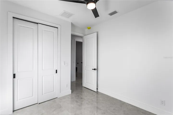 A split floor plan provides privacy for guests, with a hallway bath that also serves as a pool bath.