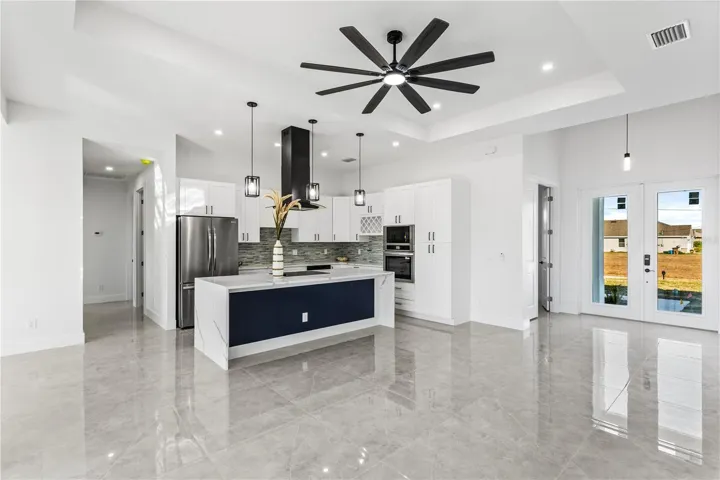 Tile flooring throughout enhances the home with a clean, modern look while offering durability, easy maintenance, and a cool, comfortable feel ideal for Florida living.