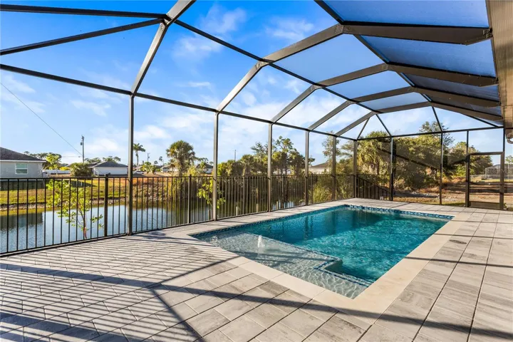 The screened-in pool and lanai offer a private, low-maintenance outdoor retreat—ideal for year-round swimming, entertaining, and enjoying the Florida lifestyle with added comfort and protection