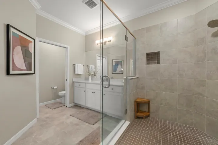 Inside the walk-in shower. Please note the separate water closet.