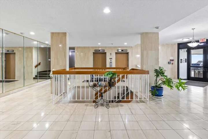 Bright, clean, and secure — this welcoming lobby features dual elevators, polished tile floors, and a well-maintained common area that sets the tone for comfortable coastal living.