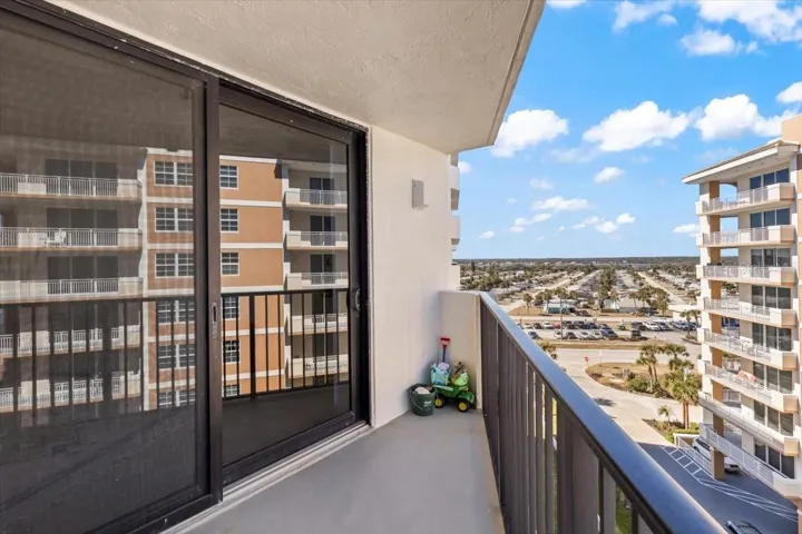 8th-floor balcony offering expansive city and coastal views. Enjoy fresh ocean breezes and peaceful mornings from this private outdoor space, complete with sliding glass doors that bring in natural light and extend your living area outdoors. Perfect for relaxing or enjoying your morning coffee above it all.