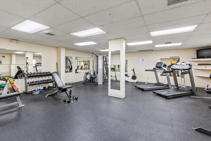 Updated fitness center with a variety of strength and cardio equipment, including treadmills, weight machines, and free weights—perfect for maintaining an active lifestyle just steps from your residence.