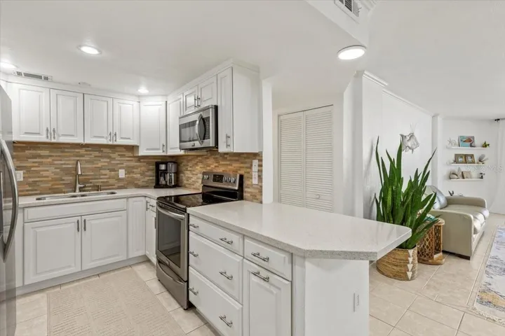 Kitchen, dining area open.