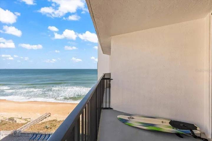Private oceanfront balcony with sweeping Atlantic views and direct beach access below