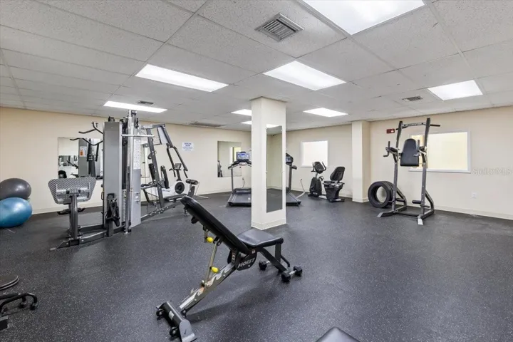 Updated fitness center with a variety of strength and cardio equipment, including treadmills, weight machines, and free weights—perfect for maintaining an active lifestyle just steps from your residence.