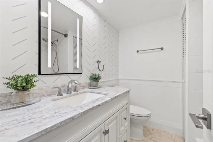 Updated Primary Bathroom with Full Shower/Tub.