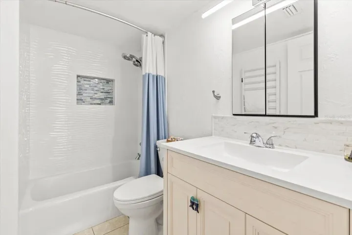 Updated modern Bathroom on left side. With Full shower/tub.